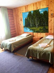 Posteľ alebo postele v izbe v ubytovaní Fishing Complex Ershikha