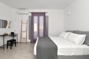 Posteľ alebo postele v izbe v ubytovaní Harmony Apartments