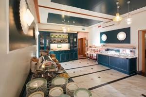 a restaurant with a counter with a lot of dishes at Hotel Villa Adriana in Monterosso al Mare