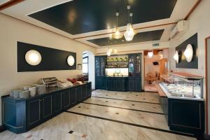 a restaurant with a counter in a room at Hotel Villa Adriana in Monterosso al Mare