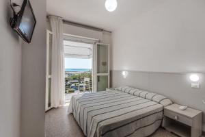 Posteľ alebo postele v izbe v ubytovaní Hotel Blues