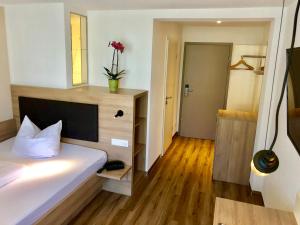Postel nebo postele na pokoji v ubytování Flair Hotel Grüner Baum