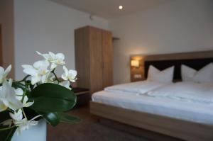 Postel nebo postele na pokoji v ubytování Flair Hotel Grüner Baum