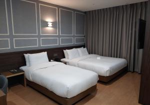 Postel nebo postele na pokoji v ubytování Notte La Mia Hotel