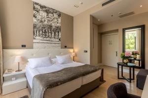 Krevet ili kreveti u jedinici u okviru objekta Cornaro Hotel