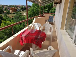 a balcony with a table and chairs on a balcony at apartament Sea Star in Byala