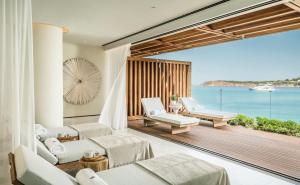 a living room with a view of the ocean at Four Seasons Astir Palace Hotel Athens in Athens