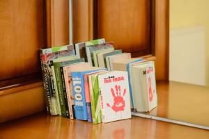 a row of books sitting on a shelf at Pałac w Małkowie in Warta