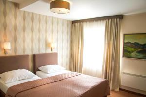 Katil atau katil-katil dalam bilik di Philia Hotel