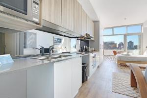 a kitchen with a sink and a counter top at Trendy, Central Sentinel - Heart of Cape Town in Cape Town