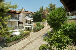 an aerial view of a building with trees and a road at Izabella Sea Side Villa in Siviri