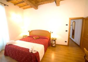 Postel nebo postele na pokoji v ubytování HG Abetone e Piramidi Resort