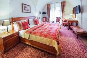 Postel nebo postele na pokoji v ubytování Arcadia Boutique Hotel