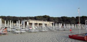 a group of chairs and tables on a beach at Palazzo Mosca in Sannicola