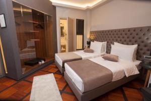 Postel nebo postele na pokoji v ubytování Solun Hotel & SPA