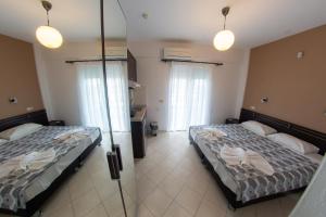 Postel nebo postele na pokoji v ubytování Klepsidra rooms