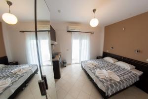Postel nebo postele na pokoji v ubytování Klepsidra rooms