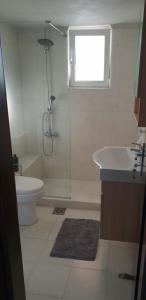 a bathroom with a shower and a toilet and a sink at Villa Fotini I in Amalias +38 photos