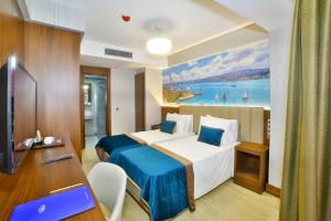 Postel nebo postele na pokoji v ubytování The Tango Hotel Taksim