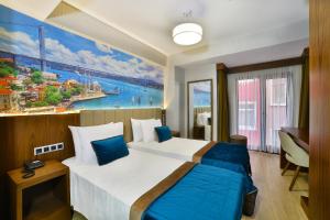 Postel nebo postele na pokoji v ubytování The Tango Hotel Taksim