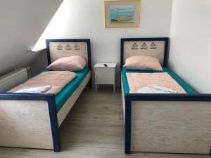 Postel nebo postele na pokoji v ubytování Pension Adler