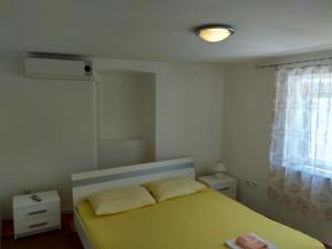 Кровать или кровати в номере Apartments Grkinić