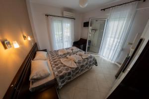 Postel nebo postele na pokoji v ubytování Klepsidra rooms