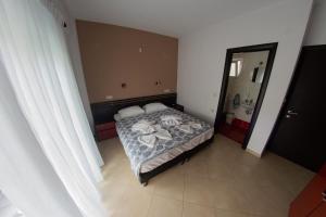Postel nebo postele na pokoji v ubytování Klepsidra rooms