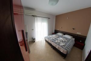 Postel nebo postele na pokoji v ubytování Klepsidra rooms