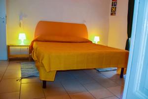 Een bed of bedden in een kamer bij In Centro Da Piero - Appartamento In Via Della Viola