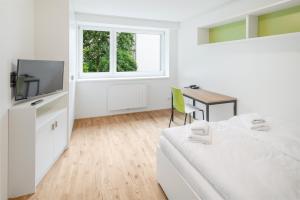 TV i/ili multimedijalni sistem u objektu myNext - Hotel Leo