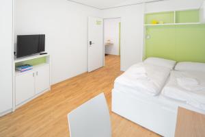 TV i/ili multimedijalni sistem u objektu myNext - Hotel Leo