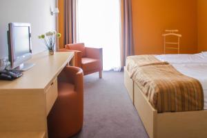 Ένα ή περισσότερα κρεβάτια σε δωμάτιο στο Hotel Veter