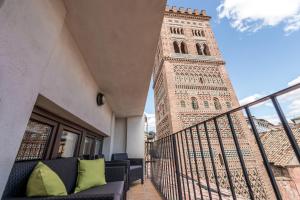 a view of the big ben clock tower from a balcony at La Torre Boutique Apartamentos in Teruel