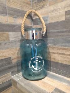 a green teapot with an anchor on it at Le Sémaphore - studio climatisé, grande terrasse vue mer - parking, wifi in La Grande Motte