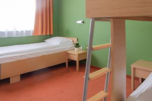 Ένα ή περισσότερα κρεβάτια σε δωμάτιο στο Hotel Veter