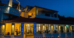 a building with a sign that reads hotel positano at Hotel Elena Syvota in Syvota