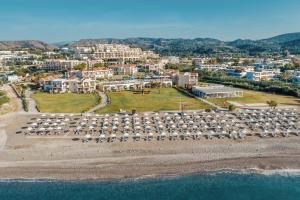 an aerial view of a beach with a resort at Lindos Imperial Resort & Spa in Kiotari