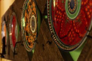 a close up of a wooden wall with plates on it at Agriturismo Mezzaluna in Málchina