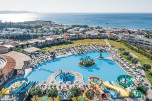 a large pool of water in front of a beach at Lindos Imperial Resort & Spa in Kiotari