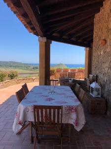 a table and chairs on a patio with a view at Chia Villa Violet in Chia
