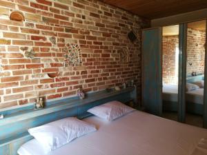 Ένα ή περισσότερα κρεβάτια σε δωμάτιο στο Arti Vila