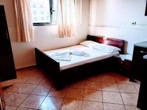 Postel nebo postele na pokoji v ubytování The First Hotel Saranda