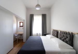 Voodi või voodid majutusasutuse Gualchierina apartment toas