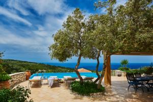 a villa with a view of the ocean at Artblue Villas in Tsoukalades