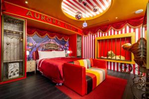 a superhero themed bedroom with a bed and a chair at AURORA MOTEL in Taichung