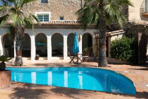 The swimming pool at or close to Casa Azul at Masia Nur Sitges, Adults only
