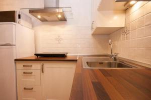 Kuchyň nebo kuchyňský kout v ubytování Apartments Mediteranea