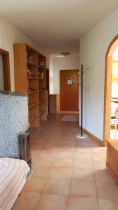 an empty room with a room with a room with a room at Alisea Home in Pinzolo