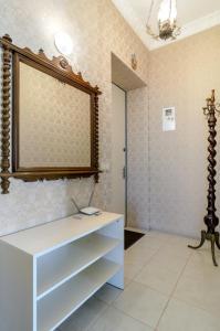 a room with a white dresser and a mirror at Rest Home in Sumy